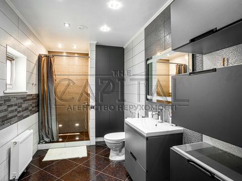 будинок за адресою с. Великі Дмитровичі, Тиханська вул., 11