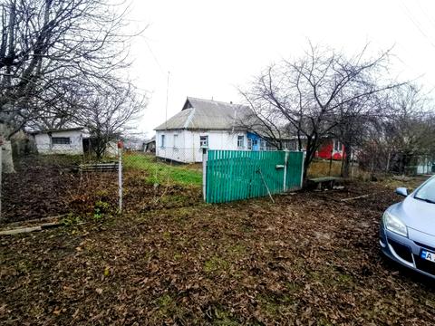 будинок за адресою с. Кривошиїнці, ковалівка 2