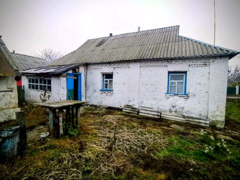 будинок за адресою с. Кривошиїнці, ковалівка 2