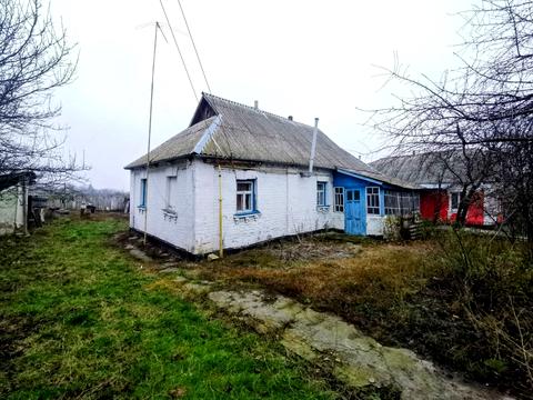 будинок за адресою с. Кривошиїнці, ковалівка 2