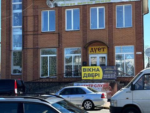 комерційна за адресою Жовтнева вул., 7