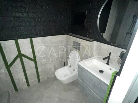 комерційна за адресою Євгена Коновальця вул. (Щорса), 44-А