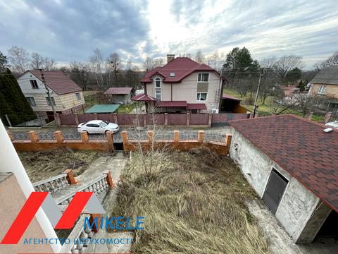 будинок за адресою смт. Козин, 2 лінія, 1