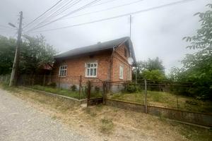 будинок за адресою смт. Розділ, Чвертьова вул., 12