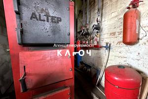 комерційна за адресою Олега Ольжича вул., 48А